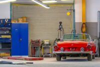 car in garage - How to Save Money on Car Running Costs and Repairs