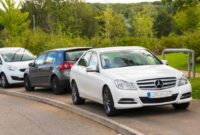 cars parked on pavement - Pavement Parking Bans – Have Your Say